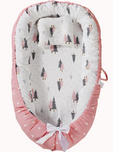 Load image into Gallery viewer, Baby nest with pink border and tree pattern on a white background