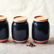 Load image into Gallery viewer, With a soft organic form and hand carved rib texture is salt&pepper's Amana Canister Set. With a distinctive black glaze, matte faux terracotta base and airtight wooden lid, this set of three 10x14cm canisters will store and keep your dry foods fresh. | Bliss Gifts & Homewares | Unit 8, 259 Princes Hwy Ulladulla | South Coast NSW | Online Retail Gift & Homeware Shopping | 0427795959, 44541523