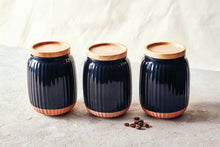 Load image into Gallery viewer, With a soft organic form and hand carved rib texture is salt&pepper's Amana Canister Set. With a distinctive black glaze, matte faux terracotta base and airtight wooden lid, this set of three 10x14cm canisters will store and keep your dry foods fresh. | Bliss Gifts & Homewares | Unit 8, 259 Princes Hwy Ulladulla | South Coast NSW | Online Retail Gift & Homeware Shopping | 0427795959, 44541523