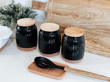 Load image into Gallery viewer, With a soft organic form and hand carved rib texture is salt&pepper's Amana Canister Set. With a distinctive black glaze, matte faux terracotta base and airtight wooden lid, this set of three 10x14cm canisters will store and keep your dry foods fresh. | Bliss Gifts & Homewares | Unit 8, 259 Princes Hwy Ulladulla | South Coast NSW | Online Retail Gift & Homeware Shopping | 0427795959, 44541523