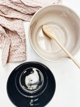 Load image into Gallery viewer, Stylish black mixing bowl filled with baking ingredients