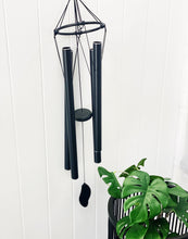 Load image into Gallery viewer, Our bold and beautiful Black Metal Harmonious Tuned Wind Chime features 5 large tubes in all different sizes to give different sounds to your outdoor space. With a strong hook at the top, this stunning wind chime gives off beautiful sound an energy. 85cm.| Bliss Gifts & Homewares | Unit 8, 259 Princes Hwy Ulladulla | South Coast NSW | Online Retail Gift & Homeware Shopping | 0427795959, 44541523