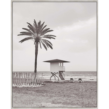 Load image into Gallery viewer, Transform your space with the calming coastal vibes of our Life Guard Framed Canvas. This gorgeous relaxed and neutral piece will bring style to any space and is an easy way to update your home decor. Finished with a natural timber look frame. 80 x 100cm.  | Bliss Gifts & Homewares | Unit 8, 259 Princes Hwy Ulladulla | South Coast NSW | Online Retail Gift & Homeware Shopping | 0427795959, 44541523