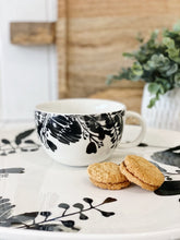 Load image into Gallery viewer, Designed to create a sophisticated affair is this NERI round platter from Salt&Pepper. Inspired by walks through sunlit forests, this lightweight 37x35cm platter features delicate silhouettes of leaves and foliage, creating an elegant yet modern effect.| Bliss Gifts & Homewares | Unit 8, 259 Princes Hwy Ulladulla | South Coast NSW | Online Retail Gift & Homeware Shopping | 0427795959, 44541523