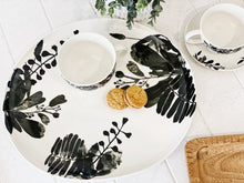 Load image into Gallery viewer, Designed to create a sophisticated affair is this NERI round platter from Salt&Pepper. Inspired by walks through sunlit forests, this lightweight 37x35cm platter features delicate silhouettes of leaves and foliage, creating an elegant yet modern effect.| Bliss Gifts & Homewares | Unit 8, 259 Princes Hwy Ulladulla | South Coast NSW | Online Retail Gift & Homeware Shopping | 0427795959, 44541523