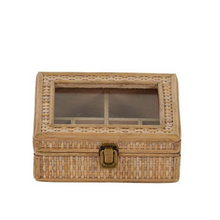 Load image into Gallery viewer, A small rectangular rattan weave jewelry box with a clear window on the lid, featuring a metal lock.