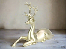 Load image into Gallery viewer, Elegant champagne reindeer statue, sitting pose.