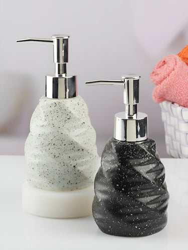 Refillable soap dispenser, terrazzo and ceramic.

