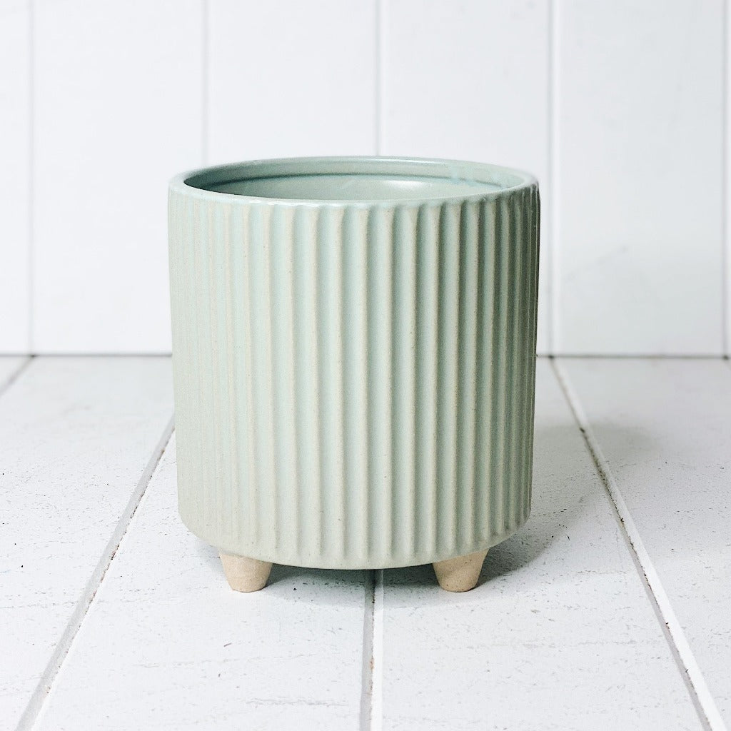 Display your favourite floral accents with our beautiful Fraser Ceramic Pot with Feet. The soft tone will suit any decor, while the ribbed pattern adds texture to any space. 13.5 x 14.3cm.| Bliss Gifts & Homewares | Unit 8, 259 Princes Hwy Ulladulla | South Coast NSW | Online Retail Gift & Homeware Shopping | 0427795959, 44541523