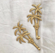 Load image into Gallery viewer, Our Islander Palm Tree Wall Hook has two brass swaying palm trees and a single hook. This little beauty is great to hang your keys, hat or towels. Our Islander Palm Tree Wall Hook comes with screws ready to hang. Add a touch of the tropics to your decor.| Bliss Gifts &amp; Homewares | Unit 8, 259 Princes Hwy Ulladulla | South Coast NSW | Online Retail Gift &amp; Homeware Shopping | 0427795959, 44541523