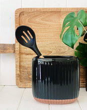 Load image into Gallery viewer, Created from stoneware with a soft organic form and hand carved rib texture is our Amana Utensil Holder. With a distinctive glossy black glaze and matte faux terracotta base, this 16.5x11x16cm utensil holder is ideal for keeping your bench top tidy.| Bliss Gifts &amp; Homewares | Unit 8, 259 Princes Hwy Ulladulla | South Coast NSW | Online Retail Gift &amp; Homeware Shopping | 0427795959, 44541523